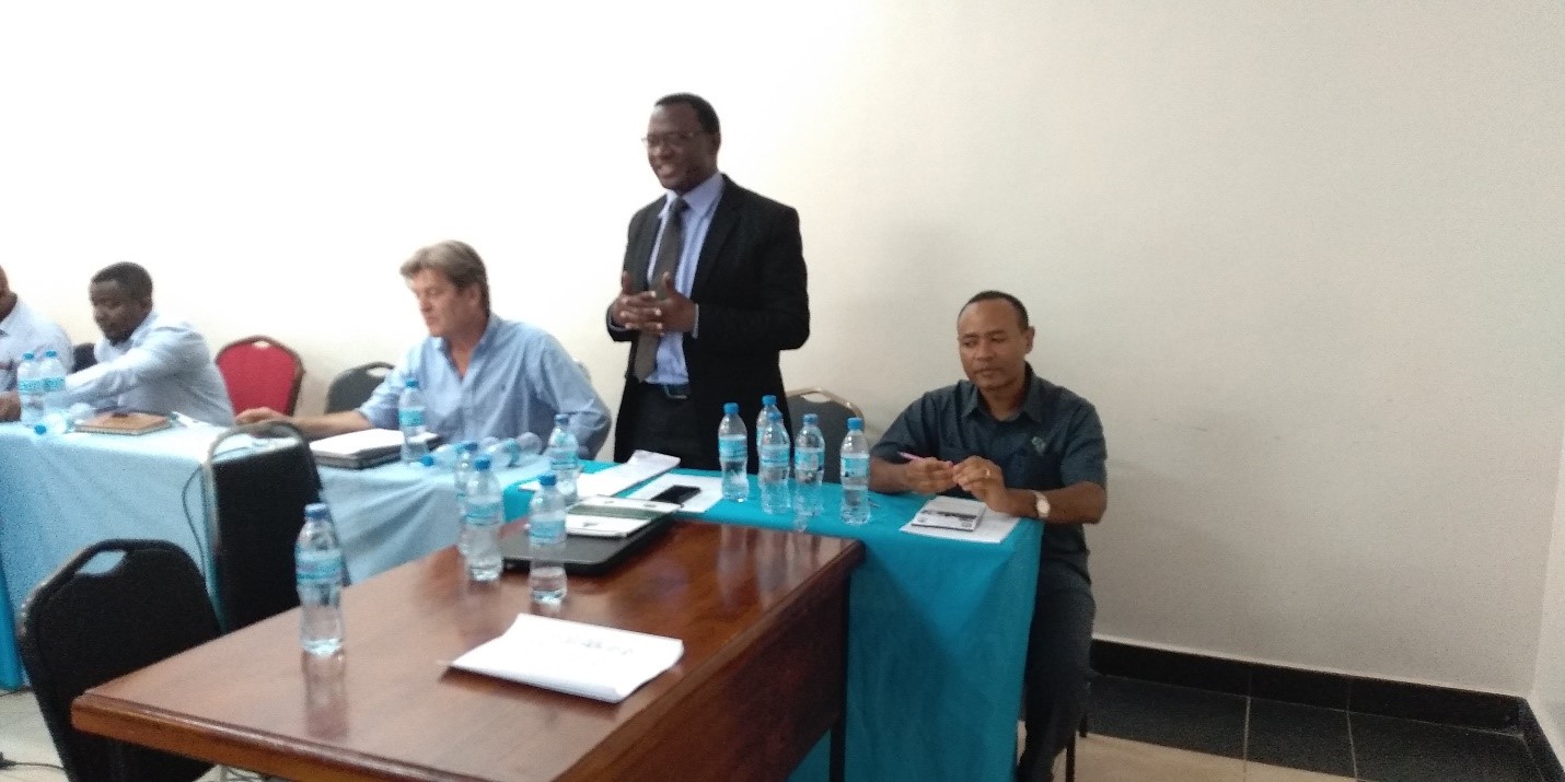 Director of Forest and Beekeeping Division Dr. Ezekiel Mwakalukwa second from right giving his remarks during the workshop