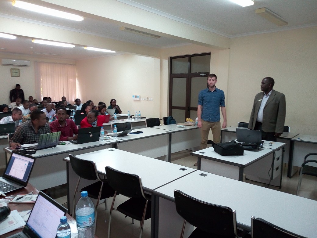 Prof. Japhet J. Kashaigili introducing Trainer Joe Gosling from UNEP WCMC with the blue shirt to participants.png
