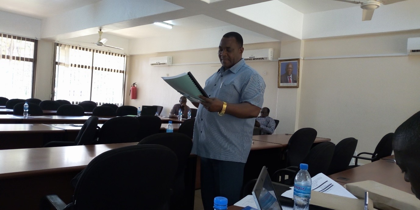 Workshop facilitator Dr. Berno Mnembuka describing group assignment packages to the participants